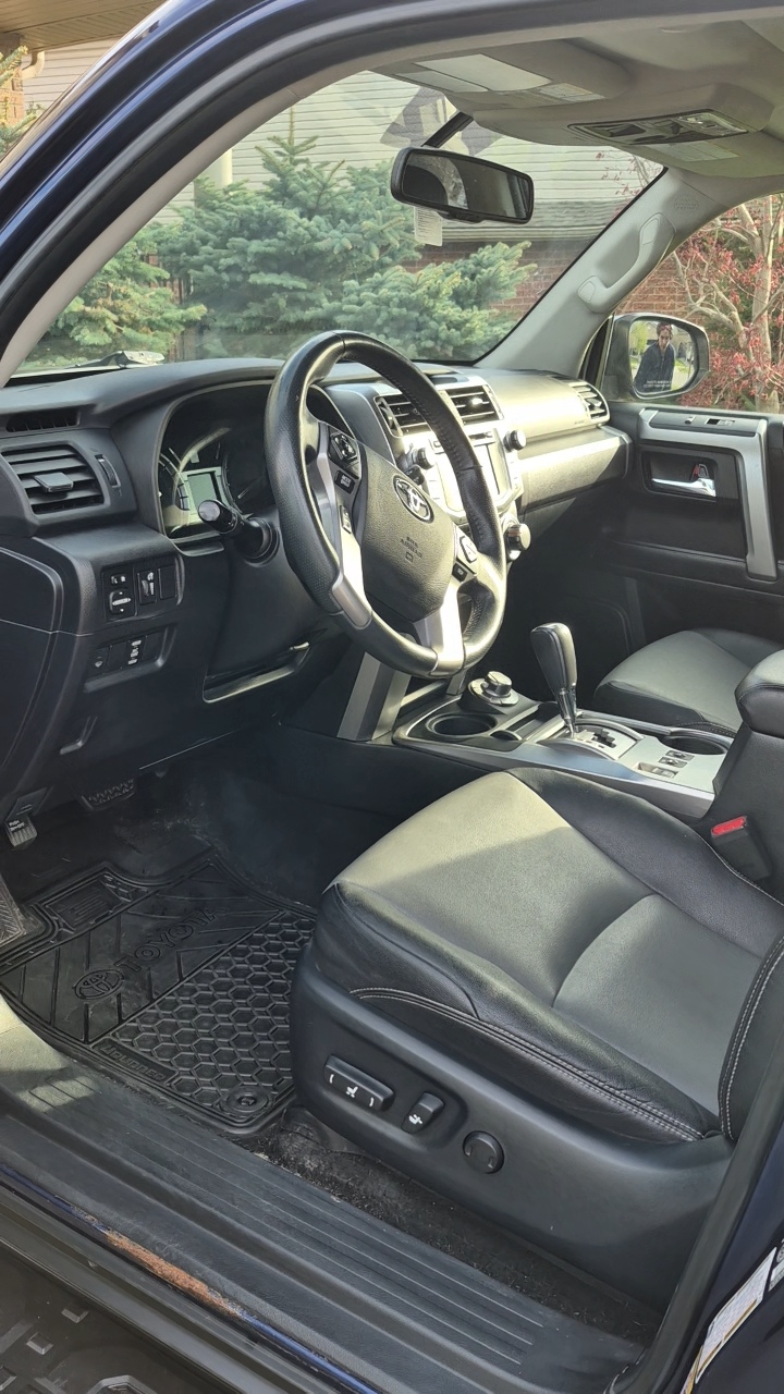 Fresh clean car carpet after shampoo — bright clean fabric fibers in well-lit interior